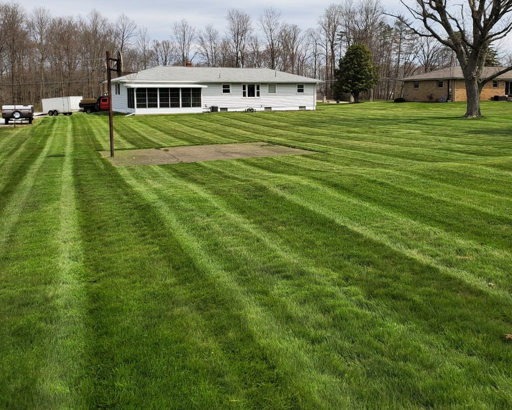 Lawn aeration and overseeding service in Canton Ohio Weekly lawn maintenance and mowing in Canton Ohio neighborhood