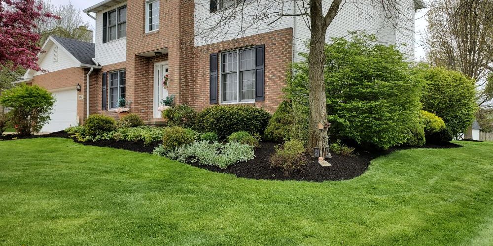 Custom fire pit and patio landscaping in Canton Ohio backyard
